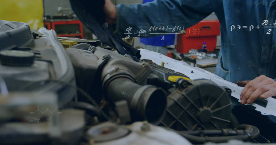 Mechanic cleaning engine bay with rag to inspect, donning gloves and lifting engine cover in garage. Automotive, industrial, technical, durability, efficiency, precision, machinery