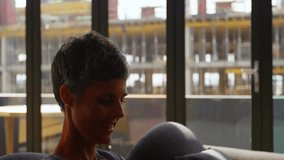 Picking smartphone on sofa, woman tapping and spawning cart and lock icons for secure e-commerce. Technology, digital, security, commerce, connectivity, online shopping, innovation - Powered by Shutterstock - Get 15% off with code: PIKWIZARD15