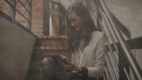 woman seated tapping tablet on stairs as clear globe fading in and rotating exploring tech data. Innovation, globalization, technology, contemporary, professional, networking, urban - Powered by Shutterstock - Get 15% off with code: PIKWIZARD15