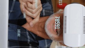 Animation of numbers changing and processing over man wearing vr headset. digital interface global connection and communication concept digitally generated video. - Powered by Shutterstock - Get 15% off with code: PIKWIZARD15