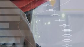 Close up of a Muslim woman wearing a hijab typing on her phone while riding in a moving vehicle. Digital animation of graphs and statistics are running in the foreground - Powered by Shutterstock - Get 15% off with code: PIKWIZARD15