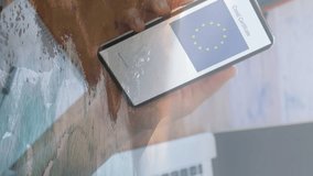 Animation of woman holding smartphone with covid 19 vaccination passport over landscape. global covid 19 pandemic and vaccination concept digitally generated video. - Powered by Shutterstock - Get 15% off with code: PIKWIZARD15