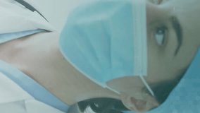 Animation of medical icons over caucasian female doctor wearing face mask. global medicine, healthcare and technology during covid 19 pandemic concept digitally generated video. - Powered by Shutterstock - Get 15% off with code: PIKWIZARD15