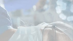 Animation of male doctor wearing a protective face mask looking at camera with surgeons operating, coronavirus Covid-19 spreading. Medicine public health pandemic coronavirus outbreak social - Powered by Shutterstock - Get 15% off with code: PIKWIZARD15