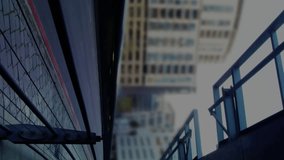 Animation of financial data processing over office buildings, modern cityscape and road traffic in fast motion in the background. Global finance business interface concept digitally generated image. - Powered by Shutterstock - Get 15% off with code: PIKWIZARD15