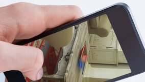 Animation of person using smartphone with house sitting room interiors displayed on screen. Online shopping house decorating concept digital composite. - Powered by Shutterstock - Get 15% off with code: PIKWIZARD15