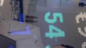 Animation of financial data processing over diverse business people using electronic devices. Global finance, business, computing and data processing concept digitally generated video. - Powered by Shutterstock - Get 15% off with code: PIKWIZARD15