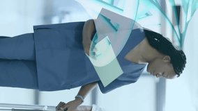 Animation of dna strand over diverse female doctor and patient in hospital. Global medicine, science, data processing and digital interface concept digitally generated video. - Powered by Shutterstock - Get 15% off with code: PIKWIZARD15