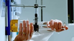 Animation of scientific data processing over caucasian male scientist in laboratory. Global science, connections, computing and data processing concept digitally generated video. - Powered by Shutterstock - Get 15% off with code: PIKWIZARD15