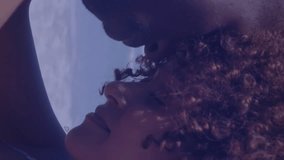 Animation of usa flag design against african american couple embracing each other at the beach. American independence patriotic holiday concept - Powered by Shutterstock - Get 15% off with code: PIKWIZARD15