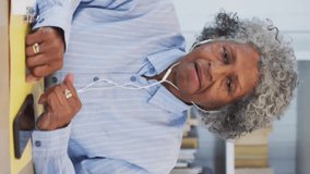 Animation of network of connections with icons over senior african american woman having video call. Global lifestyle, connections and digital interface concept digitally generated video. - Powered by Shutterstock - Get 15% off with code: PIKWIZARD15