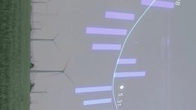 Wind turbines in field with financial data processing animation overlay. Renewable, energy, wind power, sustainability, finance, technology - Powered by Shutterstock - Get 15% off with code: PIKWIZARD15