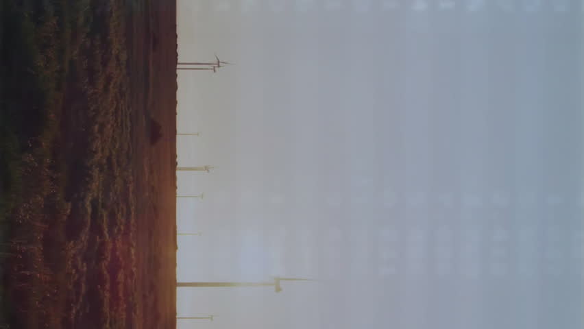 Wind turbines spinning on landscape with data processing animation overlaying scene. Renewable, energy, wind power, sustainability, environment, technology - Powered by Shutterstock - Get 15% off with code: PIKWIZARD15