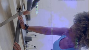 Women exercising on reformer machines with data processing animation overlay. Pilates, fitness, exercise, workout, technology, digital - Powered by Shutterstock - Get 15% off with code: PIKWIZARD15