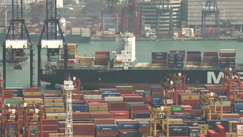 HONG KONG, CHINA - AUGUST 2012: Container Ship Arrives At Port. Shot overlooking