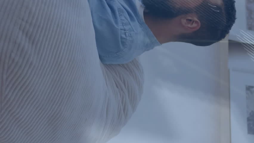 Animation of graphs, lines and computer language over caucasian man using smartphone. Digital composite, multiple exposure, report, business, programming language, coding and technology concept. - Powered by Shutterstock - Get 15% off with code: PIKWIZARD15