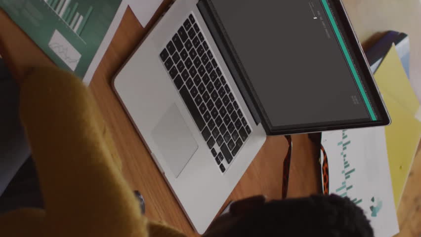 Animation of data processing over african american woman using laptop working from home. Network, data, digital interface, business, remote working and communication, digitally generated video. - Powered by Shutterstock - Get 15% off with code: PIKWIZARD15