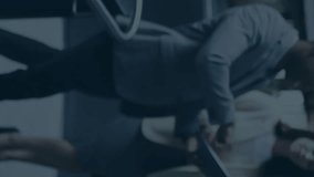 Animation of financial data and graphs over diverse coworkers in office. Business, finance, economy and cooperation concept digitally generated video. - Powered by Shutterstock - Get 15% off with code: PIKWIZARD15