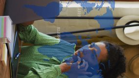 Animation of numbers, map over woman talking on cellphone and working on laptop at office. Digital composite, multiple exposure, global, digits, business, communication and technology. - Powered by Shutterstock - Get 15% off with code: PIKWIZARD15