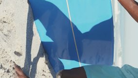 Multiple heart eyes emojis floating against african american man with surfboard on the beach. social media networking and vacation concept - Powered by Shutterstock - Get 15% off with code: PIKWIZARD15