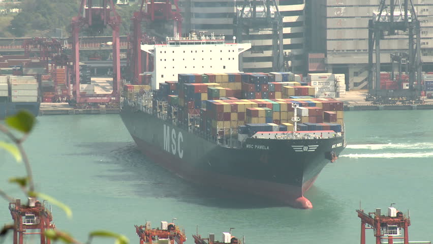 HONG KONG, CHINA - AUGUST 2012: Container Ship Maneuvering In Port Close Up.