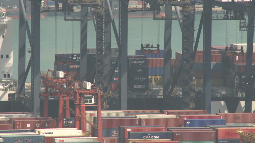 HONG KONG, CHINA - AUGUST 2012: Container Ship Berthed At Port. Shot overlooking