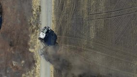 Dollar signs animation over aerial view of agricultural field with machinery. Agriculture, economy, technology, farming, finance, sustainability - Powered by Shutterstock - Get 15% off with code: PIKWIZARD15