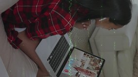 Animation of numbers changing and graphic equalizer changing over woman using laptop on video call. Digital interface global connection and communication concept digitally generated video. - Powered by Shutterstock - Get 15% off with code: PIKWIZARD15