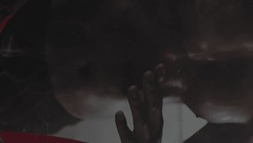 Animation of green glowing neon triangles over man wrapping hands before boxing practice. Digital interface global sport and performance concept digitally generated video. - Powered by Shutterstock - Get 15% off with code: PIKWIZARD15