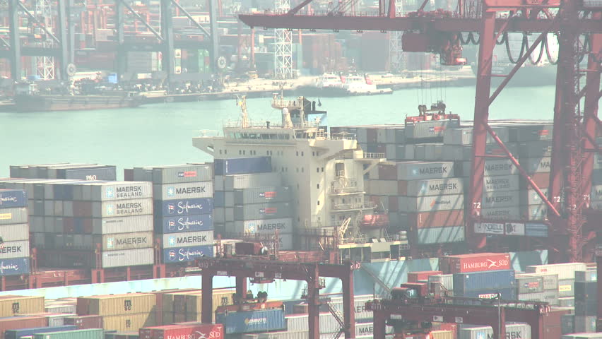 HONG KONG, CHINA - AUGUST 2012: Containers Unloaded From Ship At Port. Shot