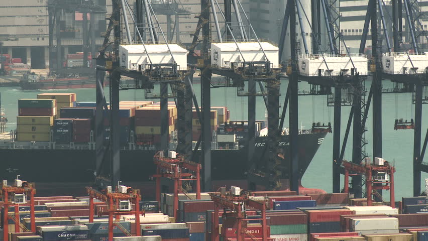 HONG KONG, CHINA - AUGUST 2012: Container Ship Arrives At Port. Shot overlooking