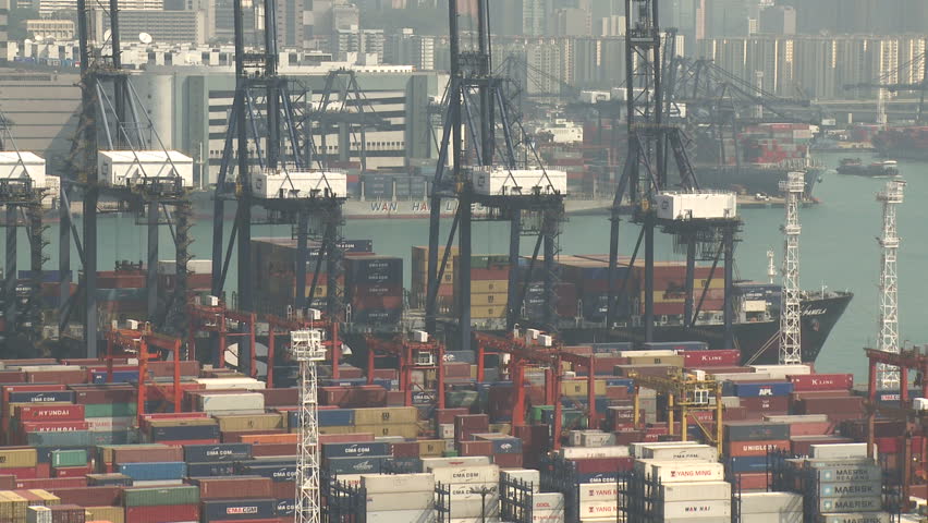 HONG KONG, CHINA - AUGUST 2012: Container Ship Berthed At Port. Shot overlooking