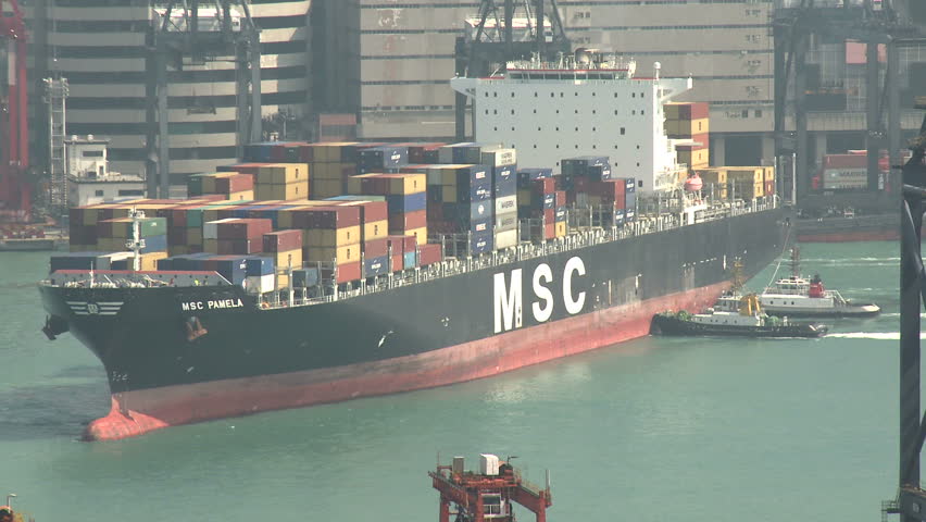 HONG KONG, CHINA - AUGUST 2012: Container Ship Maneuvering In Port Close Up.