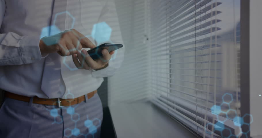 Tech pro tapping smartphone by blinds, hex overlays forming DNA strand then fading with code. Innovation, cybersecurity, data analysis, futuristic, corporate, digital, networking