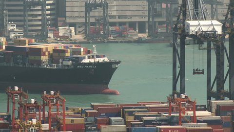 HONG KONG, CHINA - AUGUST 2012: Container Ship Arrives At Port. Shot overlooking Hong Kong container terminal in full HD on Sony EX1.