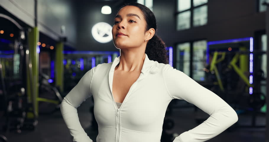 Happy, personal trainer and face of woman in gym for exercise, training routine and workout. Fitness center, health club and portrait of person with confidence, pride and smile for wellness coach