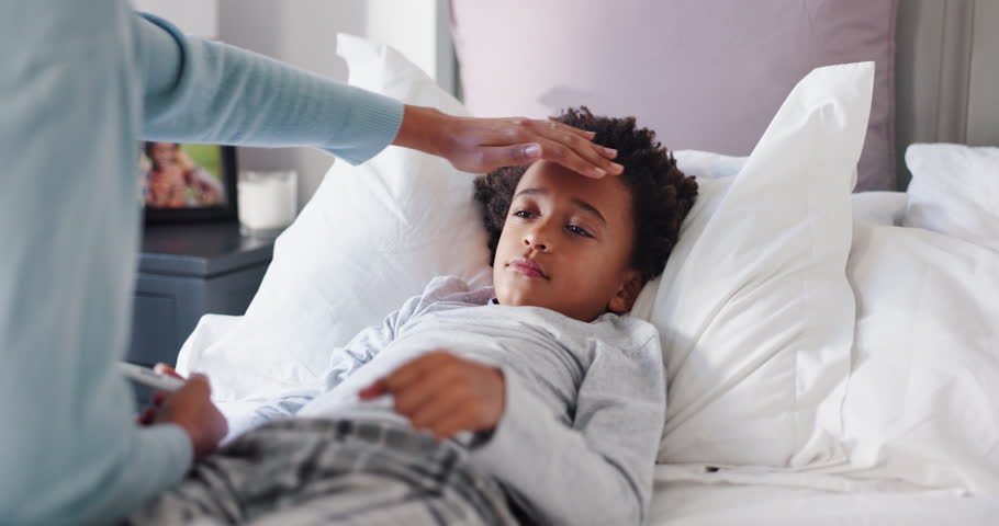 Parent, sick child and fever with thermometer in bed for illness, influenza or allergy in home. Hand, kid and son with guardian checking temperature for monitoring flu, cold or symptoms in bedroom