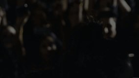 Singer raising mic, singing on stage, green particle spiral forming around grille enhancing vocals. Concert, performance, stage, lighting, energy, atmosphere, spectacle - Powered by Shutterstock - Get 15% off with code: PIKWIZARD15