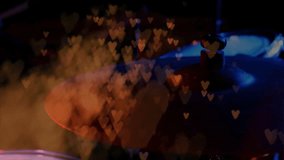 Off-screen drumstick striking cymbal causing vibrating glow stirring smoke hearts visualizing music. Musician, concert, atmospheric, glow, abstract, stage, sound - Powered by Shutterstock - Get 15% off with code: PIKWIZARD15