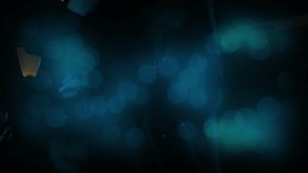 Drifting blue orbs parting bandmates playing guitar singing into mic on amber-lit stage to perform. Concert, stage, performance, musical, ambiance, entertainment, lighting - Powered by Shutterstock - Get 15% off with code: PIKWIZARD15