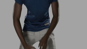 Football player lifting head and adjusting straps for snap causing data overlay growing in tech lab. Athlete, sports, technology, digital, futuristic, performance, innovation - Powered by Shutterstock - Get 15% off with code: PIKWIZARD15