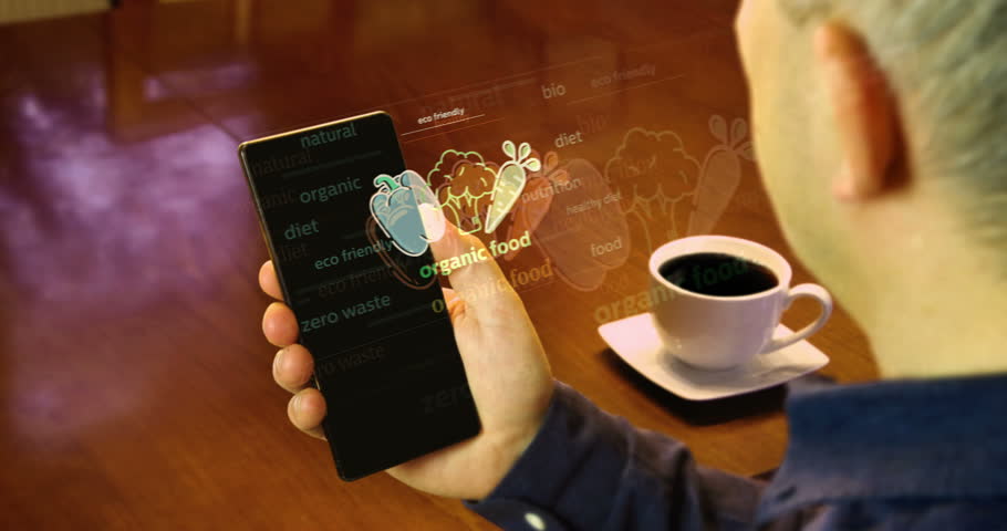 Organic food and eco friendly natural diet symbol on smartphone. Abstract concept of news titles on phone in hand.