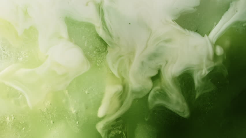 Super Slow Motion Detail Shot of Pouring Cream into Matcha Latte at 1000fps.
