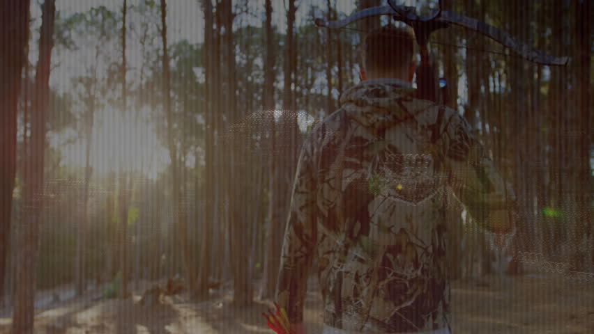 Hunter carrying compound bow walking pine path causing binary holograms forming tech grids. Adventure, wilderness, technology, exploration, innovation, outdoor, stealth