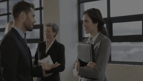 Man gesturing and woman smiling sparking data overlay highlighting business insights during meeting. Teamwork, collaboration, corporate, digital, communication, innovation, professional - Powered by Shutterstock - Get 15% off with code: PIKWIZARD15