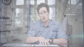 Man flipping documents in technology office studio, growing network overlay highlighting data links. Professional, analysis, data, digital, innovation, business, collaboration - Powered by Shutterstock - Get 15% off with code: PIKWIZARD15