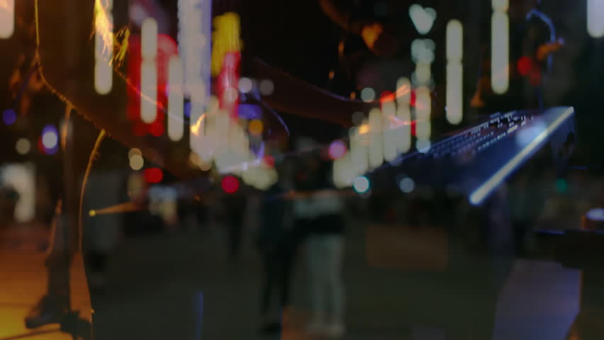 Music scene showing keyboardist playing on neon street drawing listener while merging city backdrop. Urban, nightlife, vibrant, performance, ambience, engagement, contemporary