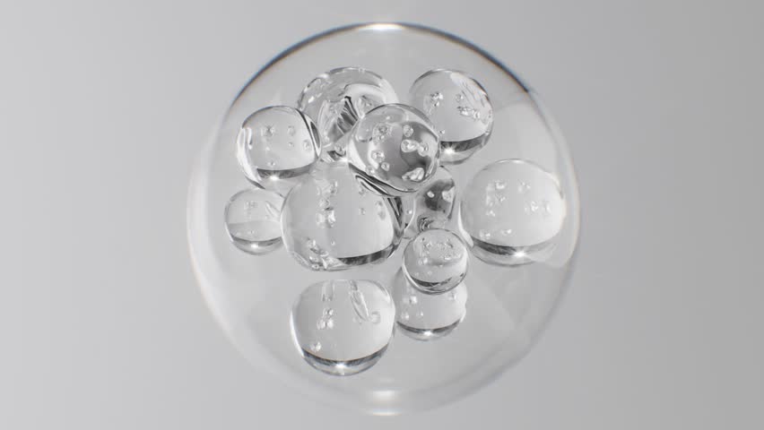 Abstract cosmetic background with glass spheres and bubbles inside a larger orb. Hyaluronic acid, serum, or the molecular structure of a hydrating essence motion science concept.