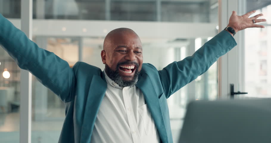 Happy, black man and cheering with laptop in office for good news, article success and bonus. Excited, mature journalist and pc with positive feedback, story promotion and celebration for publication
