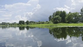 Boating on a lake on a cloudy summer day. The stroke of an oar over the water. - Powered by Shutterstock - Get 15% off with code: PIKWIZARD15